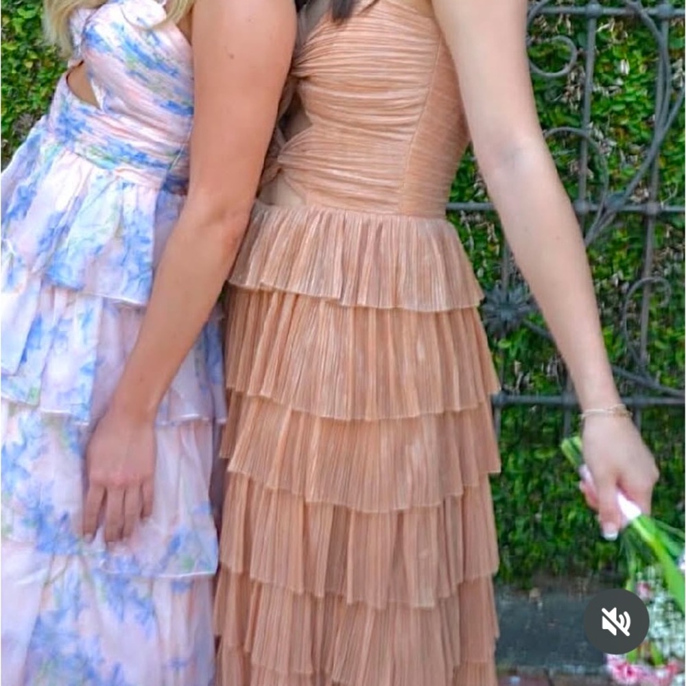 size 6 prom dress (pictured on the right)
worn once 
gold/metallic color
tiered